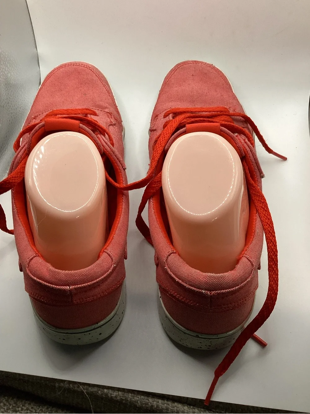 Nike 6.0 skate shoes featuring a vibrant red canvas upper and a speckled midsole